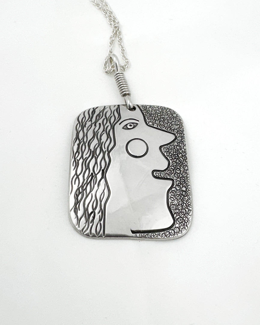 "Curley" sterling silver pendant by Luke Haley (Navajo)