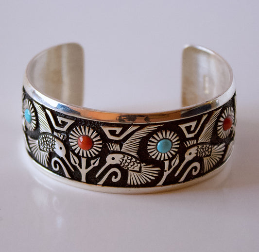 Silver Bracelet with Hummingbirds and Flowers by Philbert Begay - Navajo